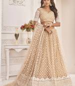 Beige embroidered net semi stitched lehenga