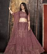 Peach sequins net semi stitched lehenga