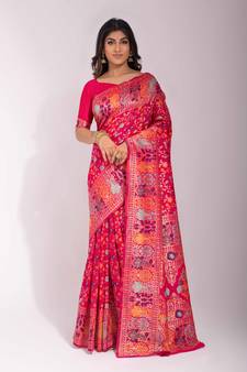 Rani pink woven Banarasi silk blend saree with blouse