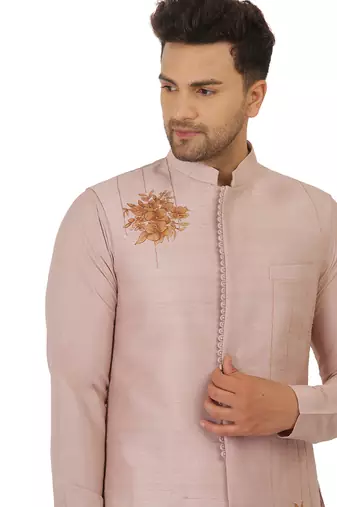 Featuring Acrylic motif indowestern in powder pink with kurta and churidaar.