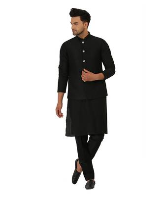 Featuring a black Quiled nehru jacket in art silk base. It is paired with a matching kurta and pants in ruby silk base. 2
