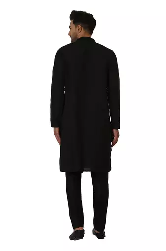 Featuring a black Quiled nehru jacket in art silk base. It is paired with a matching kurta and pants in ruby silk base.