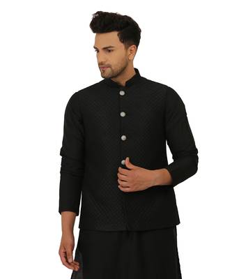 Featuring a black Quiled nehru jacket in art silk base. It is paired with a matching kurta and pants in ruby silk base. 4