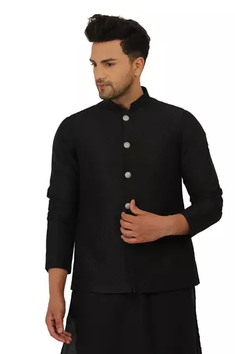 Featuring a black Quiled nehru jacket in art silk base. It is paired with a matching kurta and pants in ruby silk base.