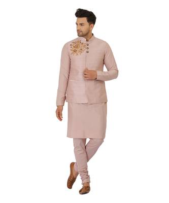 Featuring Powder pink Nehru Jacket with acrylic motif in art silk base. It is paired with kurta and churidaar. 2