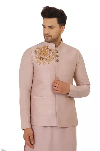 Featuring Powder pink Nehru Jacket with acrylic motif in art silk base. It is paired with kurta and churidaar.