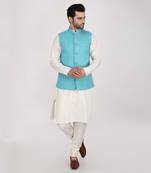 Featuring Turquoise blue qulited nehru jacket with kurta & churidaar.