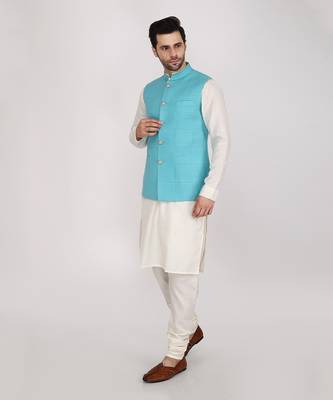 Featuring Turquoise blue qulited nehru jacket with kurta & churidaar. 2