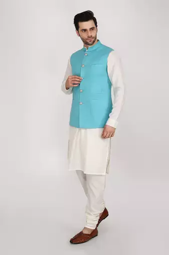 Featuring Turquoise blue qulited nehru jacket with kurta & churidaar.