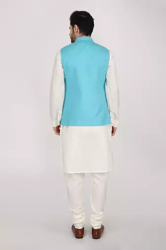 Featuring Turquoise blue qulited nehru jacket with kurta & churidaar.