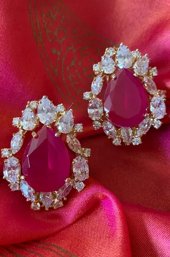 Red Pear Shaped Ruby Stud With Different Shaped Diamond Halo In 18K Gold Polish