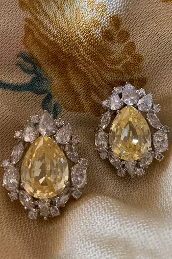 Yellow Pear Shaped Yellow Sapphire Stud With Different Shaped Diamond Halo