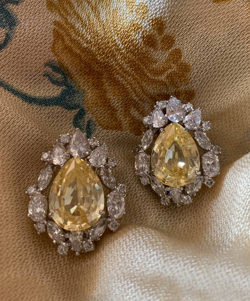 Yellow Pear Shaped Yellow Sapphire Stud With Different Shaped Diamond Halo