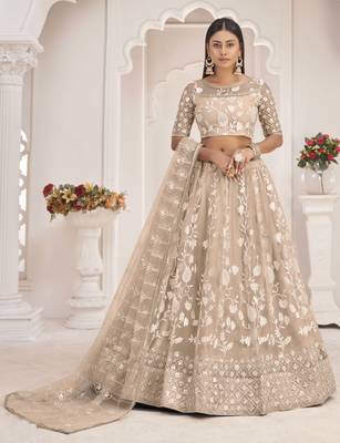 Beige embroidered net semi stitched lehenga 1