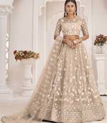 Beige embroidered net semi stitched lehenga