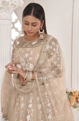 Beige embroidered net semi stitched lehenga 2