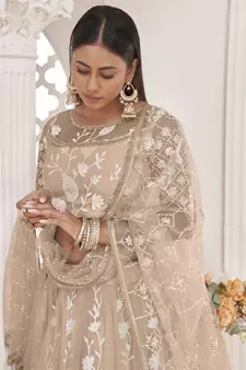 Beige embroidered net semi stitched lehenga