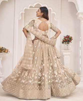 Beige embroidered net semi stitched lehenga 4