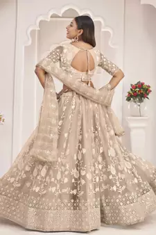 Beige embroidered net semi stitched lehenga
