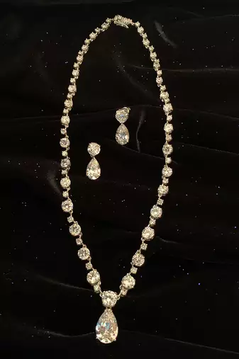 White Solitaire Necklace With Pear Drop Pendant And Earrings