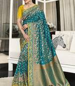 Teal woven silk saree with blouse