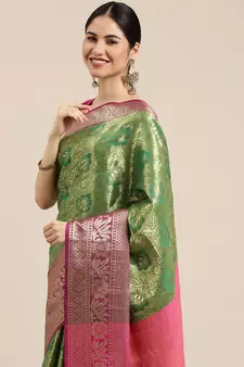 Green woven silk blend saree with blouse
