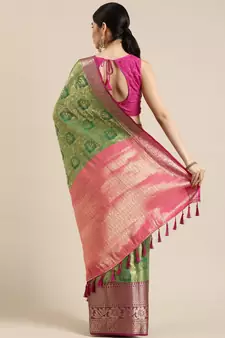 Green woven silk blend saree with blouse