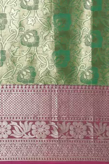 Green woven silk blend saree with blouse