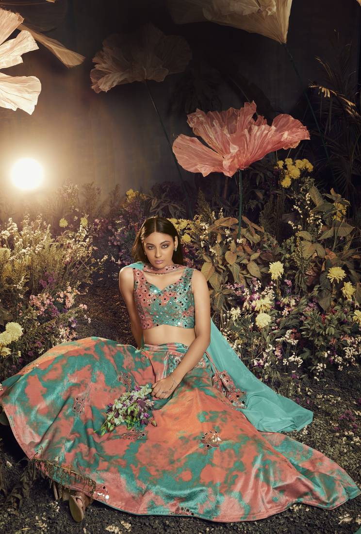 TURQUOISE ORANGE SIBURRI PRINT WITH SEQUINS EMBROIDERED AND MIRROR WORK VELVET FESTIVE & PARTY WEAR LEHENGA