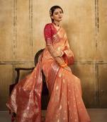 Light red woven tissue saree with blouse