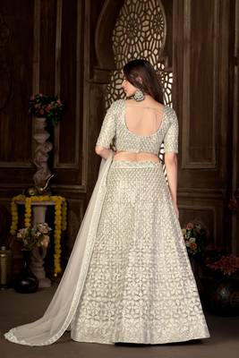 Cream thread embroidery net  lehenga 4