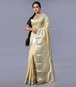 Kanjivaram silk saree in acid green color with dull zari motifs and border