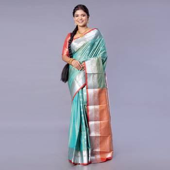 Kanjivaram silk saree in forest green color with silver zari motifs 1