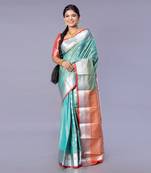 Kanjivaram silk saree in forest green color with silver zari motifs