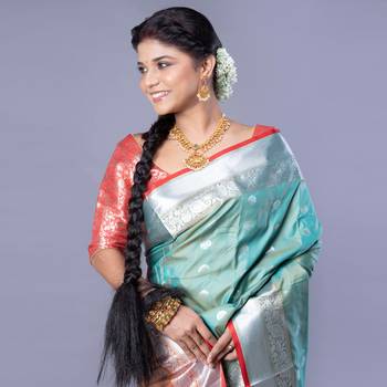 Kanjivaram silk saree in forest green color with silver zari motifs 2