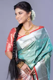 Kanjivaram silk saree in forest green color with silver zari motifs