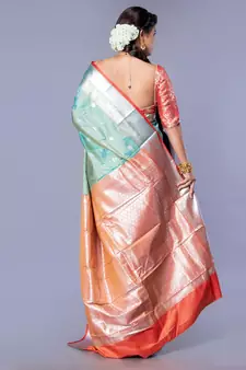 Kanjivaram silk saree in forest green color with silver zari motifs