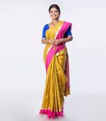 Kanjivaram saree in mustard color with contravention border and zari motifs