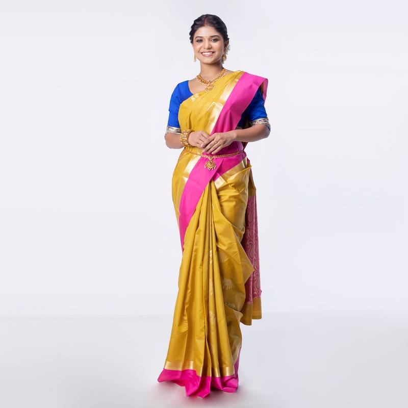 Kanjivaram saree in mustard color with contravention border and zari motifs