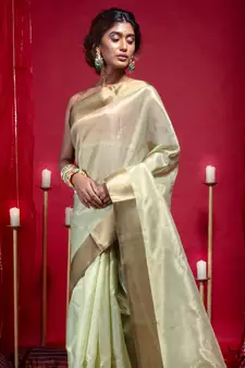 Banarasi kora organza saree in olive green color with copper zari border