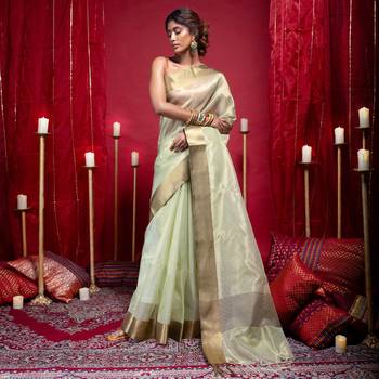 Banarasi kora organza saree in olive green color with copper zari border 1