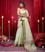 Banarasi kora organza saree in olive green color with copper zari border