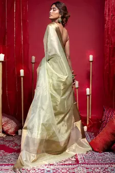 Banarasi kora organza saree in olive green color with copper zari border