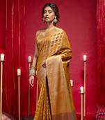 Banarasi kora organza saree in mustard gold color with zari checks and dual zari border