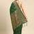 Dark green woven kanchipuram silk saree with blouse