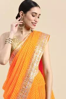Orange embroidered georgette saree with blouse