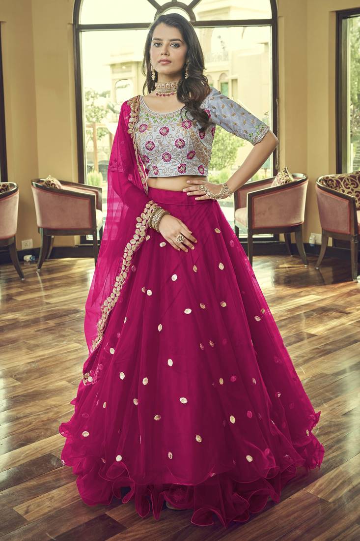 Magenta embroidered net semi stitched lehenga