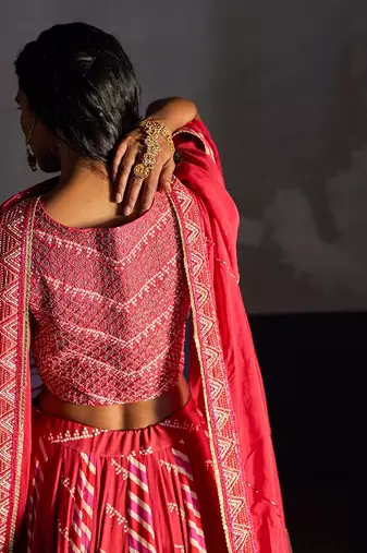 Pink Overlap Heavy Bustier With Kali Skirt And  Dupatta