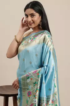 Light teal woven Banarasi silk blend saree with blouse