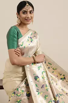 Cream woven Banarasi silk blend saree with blouse